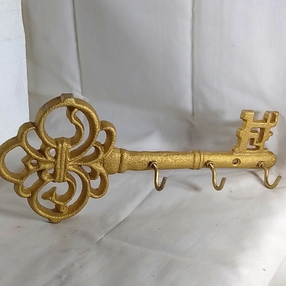 Wall Charmers Other - Beautiful gold metal key for key hanging. NIB